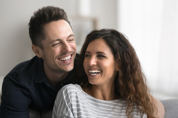 Obraz premium Happy couple laughing spend carefree time together, close up. Hispanic spouses smiling, revealing white teeth, advertising dental clinic professional services, repair, dentures, whitening procedure