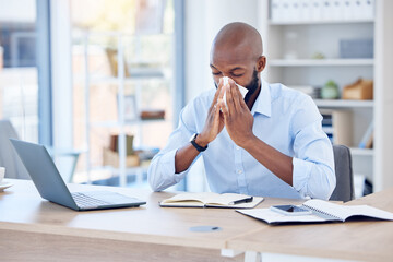 Sick, business and black man blowing nose in office for allergies, virus or flu. Lawyer, laptop and male employee with tissue by desk with notebook for disease, infection or sneeze at law firm