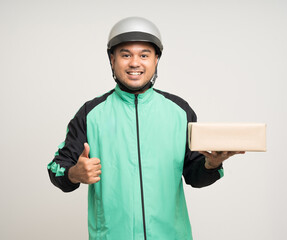 Young asian rider wearing green jacket uniform and helmet various action holding a lot of paper parcel delivery box to customer. Man service worker Courier and shipping food delivery service.