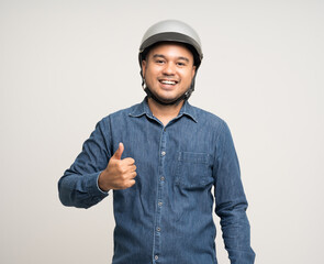 Young rider man wearing safety helmet before riding the motorcycle. Safety ride.