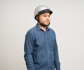 Young rider man wearing safety helmet before riding the motorcycle. Safety ride.