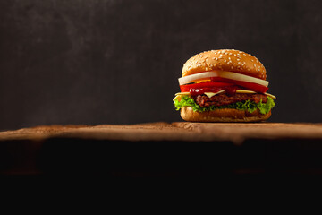 hamburger isolated on brown wooden floor background.