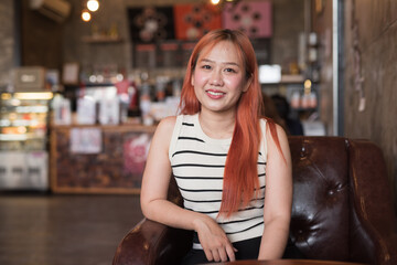 Portrait of Beautiful Asian Woman Smiling in Coffee Shop