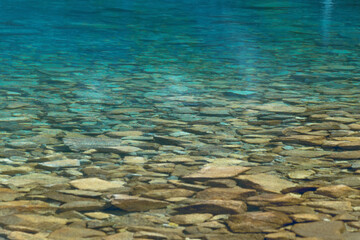 Fototapeta premium Transparent clean blue water in a mountain lake. Water background. Black Lake below Mount Rysy, Tatra Mountains