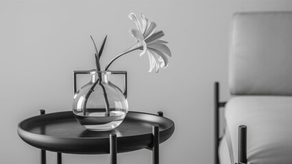 A black-and-white composition showcasing a minimalist arrangement of a single flower in a glass vase, placed on a round table beside a modern chair, emphasizing simplicity and elegance.