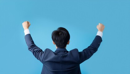Businessman raising his fist to celebrate a deal.