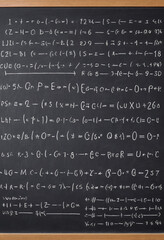  Physics equations written on a chalkboard. 