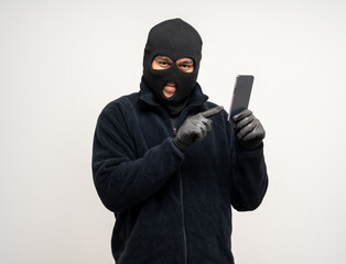 Thief in uniform black jacket various pose on isolated background. The Robber terrorism criminal...