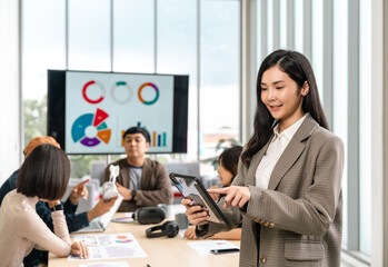 Asian business start up freelance people team analyzing statistics financial. Group Team of businesspeople man and woman Meeting Conference Discussion various topic Corporate Concept in office.