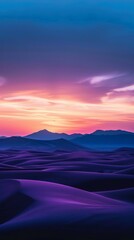 Dramatic hues of purple and orange illuminate the tranquil desert dusk