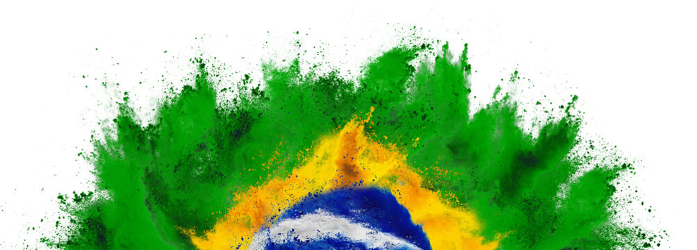 colorful brazilian flag green yellow blue color holi paint powder explosion isolated white background. Brazil south america celebration soccer and travel tourism concept.