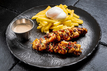 kebab with french fries and sauce