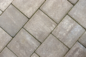 Gray paving stones. Paving surface road. Texture made of big gray cement bricks