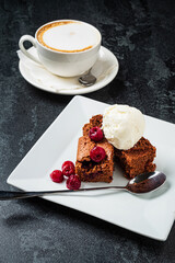 tasty brownie with cappucino on tabe