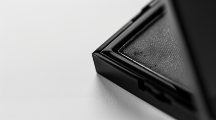 Sleek and professional black eyeshadow palette on a white background, highlighting its elegant design