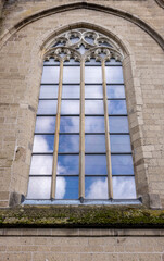 Fototapeta premium stone window of an old temple in Gothic style 