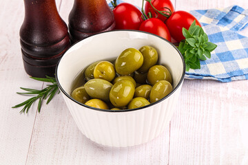 Green marinated olives in the bowl