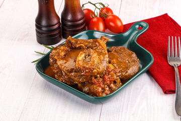 Italian cuisine - ossobuco with sauce