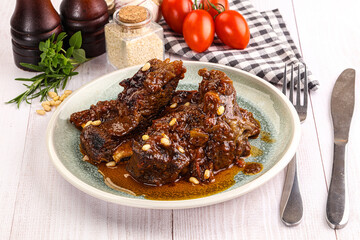 Prepared tasty beef ribs with sauce