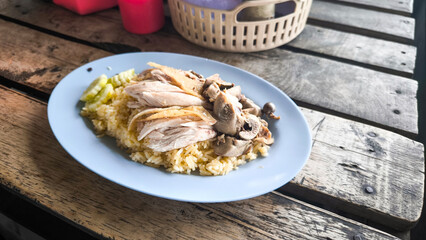 Chicken rice on a plate in a restaurant