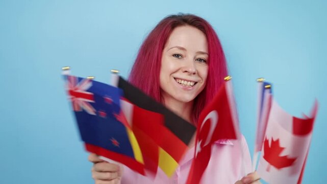Woman with pink hair and different flags on blue background, person immigrating for work, citizenship process, studying at a language academy.