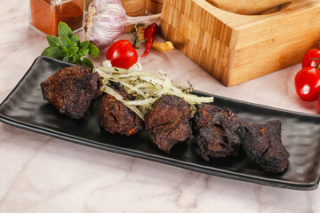 Grilled beef barbecue served onion