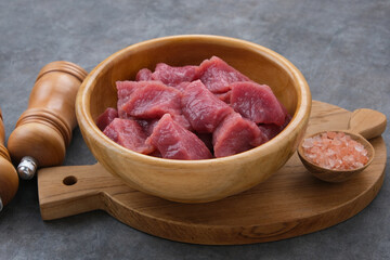 Fresh sliced raw beef (daging sapi), food preparation.
