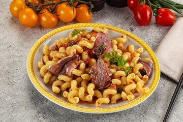 Italian pasta cellentani with anchovy