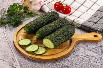 Raw green cucumbers with slices