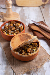 Baked meat in a clay pot, or a traditional pot dish, a stew with vegetables and meat cooked in the oven. Turkish and balkan or oriental food platter, flat lay
