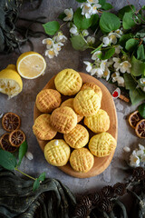 Lemon cookies for dessert for breakfast. Sweet cookies on a gray background. Close-up, Vertical photo