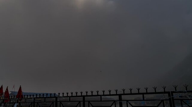 Timelapse of fast-moving clouds and fog during Manimahesh Yatra of Lord Shiva in Chamba, Kailash, Himachal Pradesh, India.
