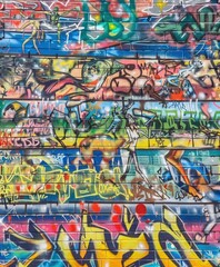 Colorful Graffiti Artwork on Brick Wall in Urban Setting at Daytime