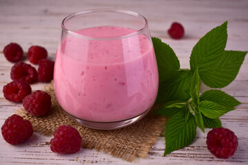 Raspberry smoothie in a glass. Close-up.
