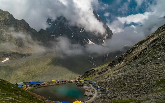 Breathtaking timelapse of Kailash Manimahesh Peak with Manimahesh Dal Lake and moving fog and cloudscape, a sacred Hindu pilgrimage site of Lord Shiva in Chamba, Himachal Pradesh.