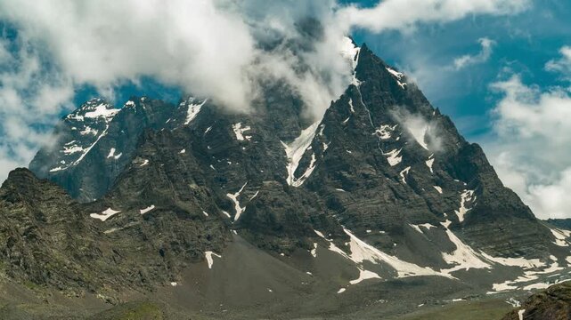 Breathtaking timelapse of Kailash Manimahesh Peak with moving fog and cloudscape, a sacred Hindu pilgrimage site of Lord Shiva in Chamba, Himachal Pradesh.