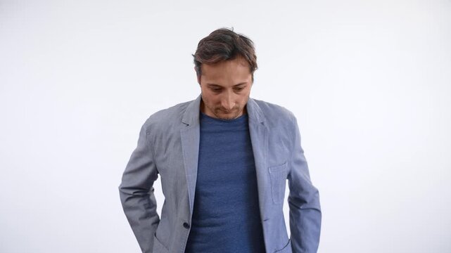 Stressed man checking his pockets, trying to find lost wallet