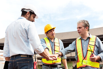 Team of engineers are working together at construction.