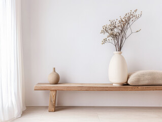Minimalist living room composition in neutral tones with minimal furniture: a couch, a rug and simple decor next to a large window. Minimalist luxurious residential property.