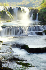 Fototapeta premium The main attraction of the Una National Park - the Strbacki Buk (Štrbački buk) waterfall. Landscape with a beautiful cascading waterfall. Nature of Bosnia and Herzegovina.