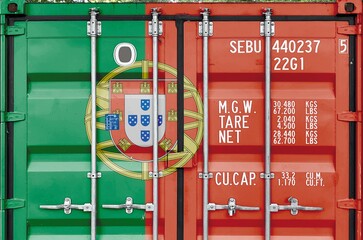 Portugal flag depicted on metal doors of shipping cargo container outdoors in docks area close up