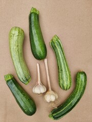zucchini  and garlic on a board