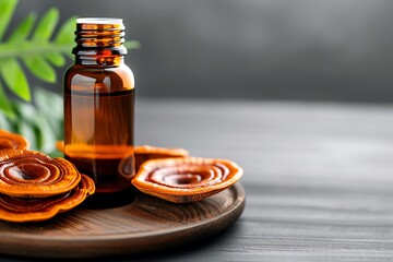 Close-up of Reishi mushroom extract in a glass bottle, surrounded by dried Reishi mushrooms on a wooden tray.