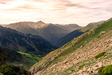 Beautiful mountain scenery. River, valley, snow, blue sky, white clouds. In-depth trip on the Sonamarg Hill Trek in Jammu and Kashmir, India