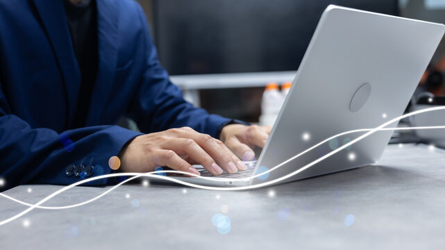 businessman use laptop to surfing the internet with virtual interface fiber optical telecommunication to exchange data information in the cyber network for business and future concept