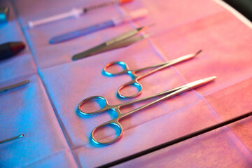 Set of stainless steel medical tools prepared for hemorrhoidectomy procedure