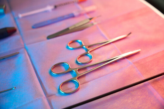 Set of stainless steel medical tools prepared for hemorrhoidectomy procedure