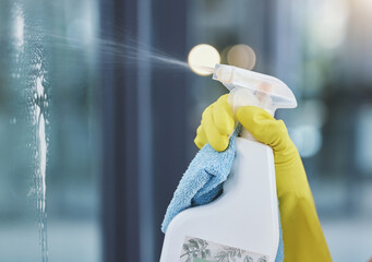 Cleaning, spray bottle and hands in gloves on window for hygiene, disinfection and bacteria for maid service. Housekeeping, spring clean and equipment for washing, sanitary and housework on glass