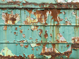 Background texture of scratched rusted steel with peeling paint