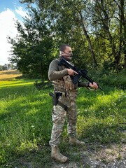 Russian soldier in occupied territory. Soldier patrols with an assault rifle